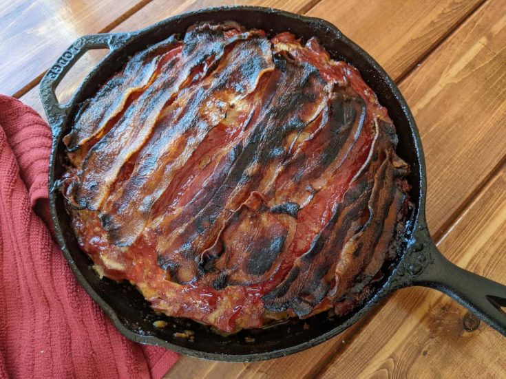 cooked meatloaf in a cast iron skillet