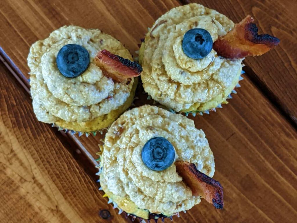 overhead view of three blueberry pancake cupcakes