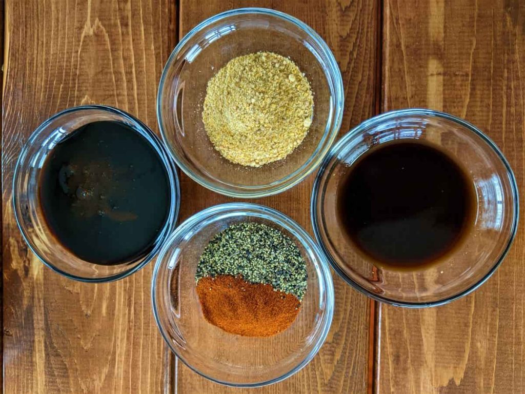 spices and sauces in bowls on a table