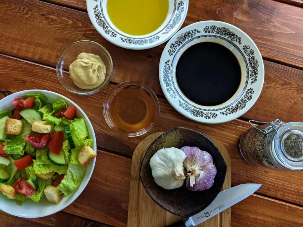ingredients for balsamic mustard salad dressing on a table