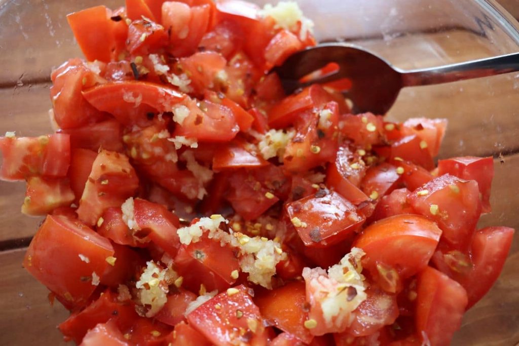 chopped tomatoes and spices in a bowl