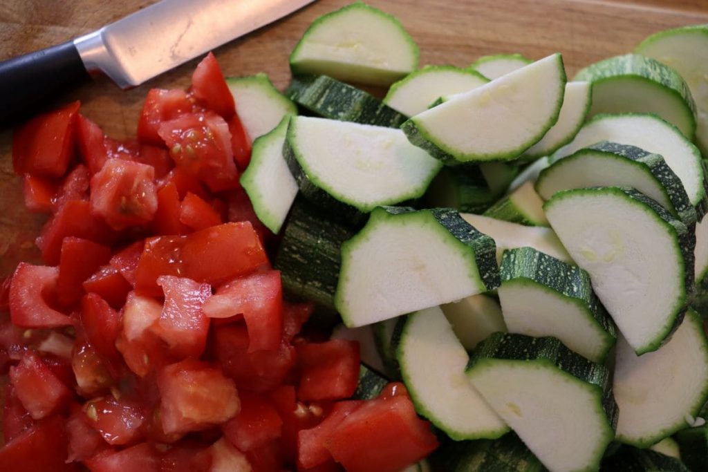 cut up vegetables on a cutting board