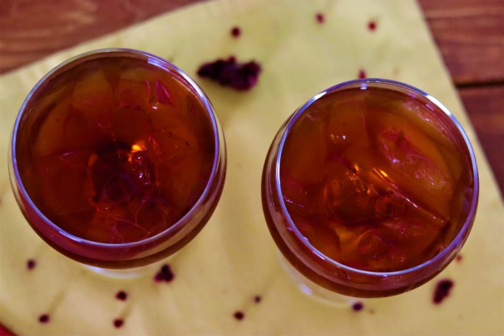 overhead view of two glasses of herbal beverage
