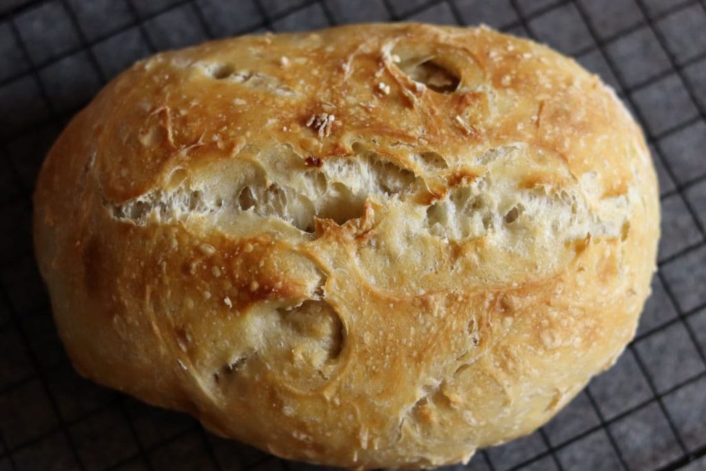 no knead bread loaf on a cooling rack