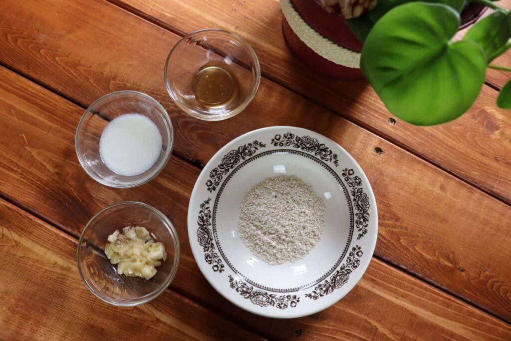 diy personal care ingredients in bowls on table