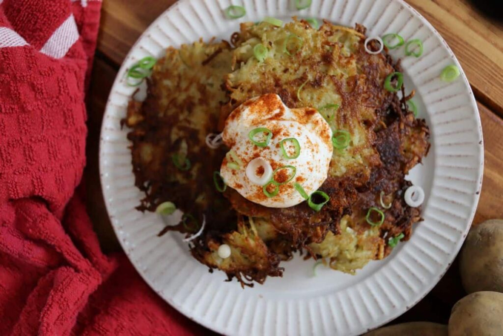potato pancakes on a dish with toppings