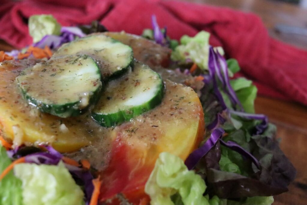 garden salad topped with tangy mustard salad dressing