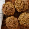 4 homemade guilt free carrot muffins on a cooling rack