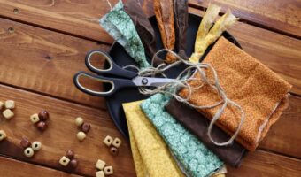 supplies to make fall rag tie garland on a table