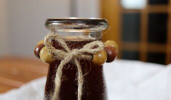 traditional rose hip syrup in a serving jar