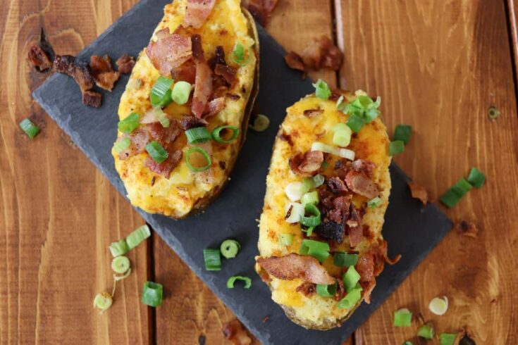 two classic twice baked potato on a slate board for serving