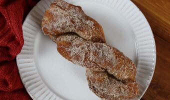 homemade cinnamon twist donut on a plate