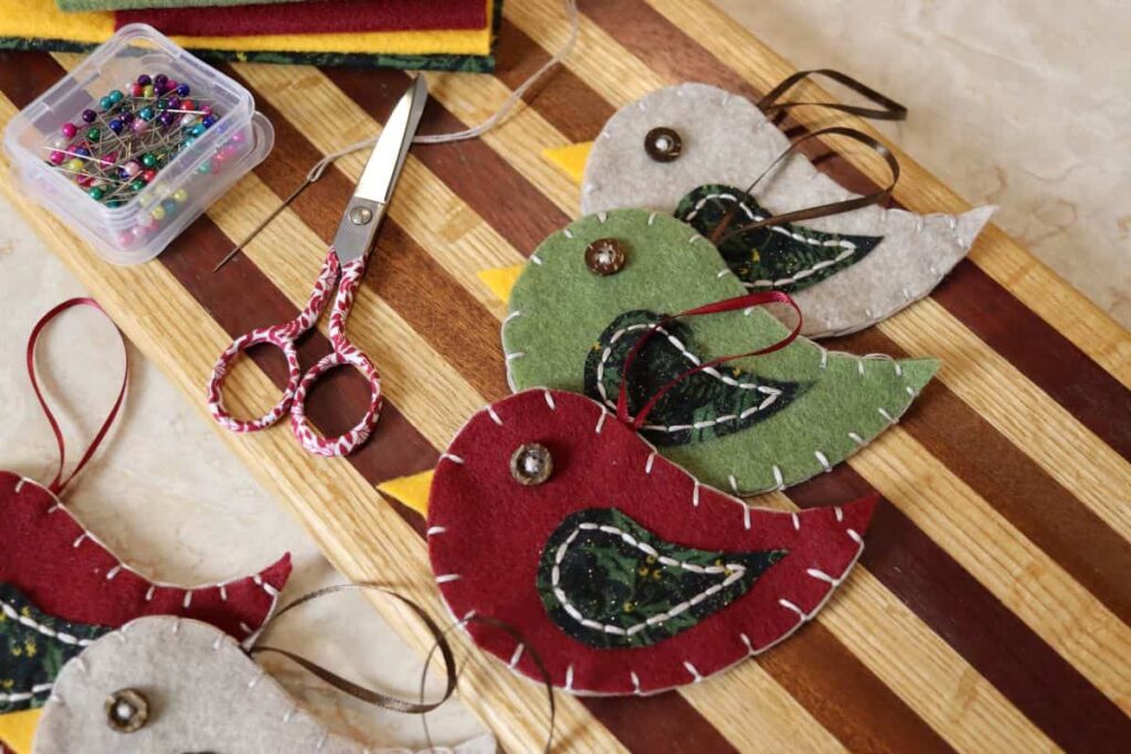 handmade ornaments and supplies on a table