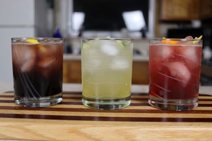 3 homemade herbal mocktails lined up on the counter