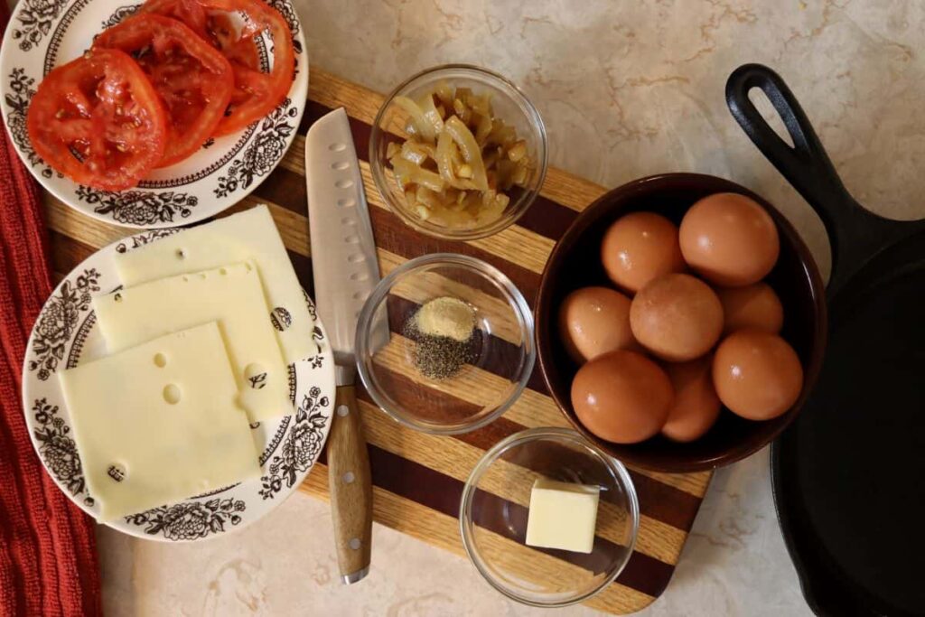 ingredients to make an omelette displayed on a counter