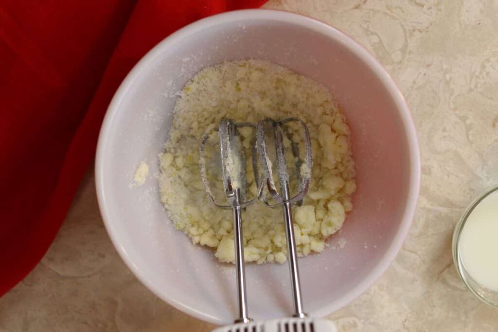 beaten butter and sugar for cake in a bowl