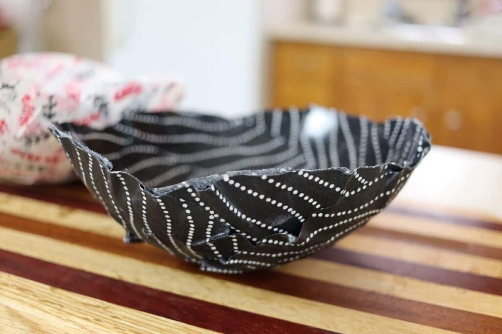 black fabric scrap mache bowl on a counter