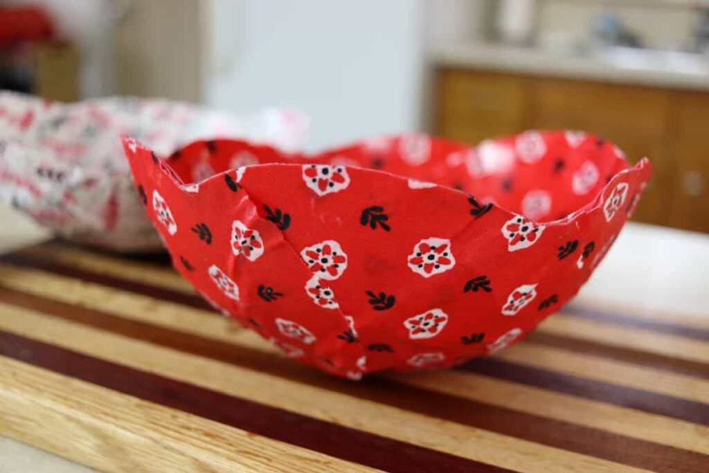 red fabric scrap mache bowl on a counter