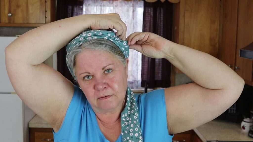 woman showing how to wrap a homemade head scarf