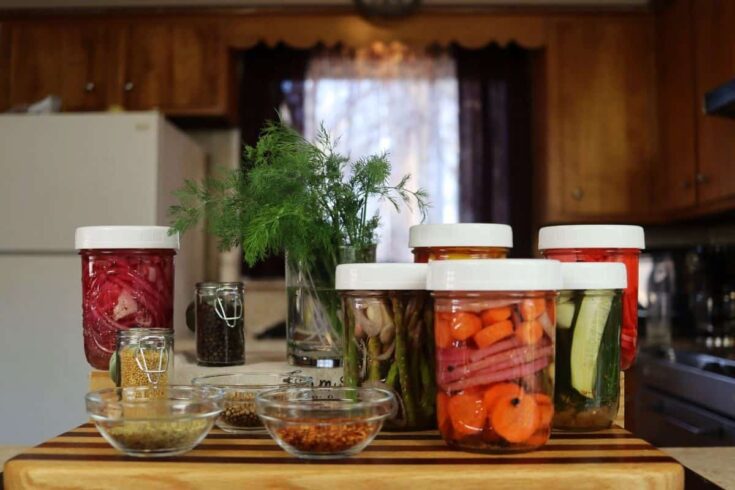 quick pickled vegetables with supplies on a counter