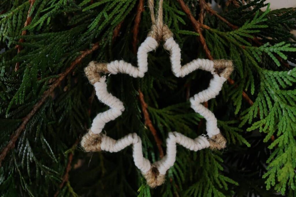diy snowflake christmas ornament hanging on a tree