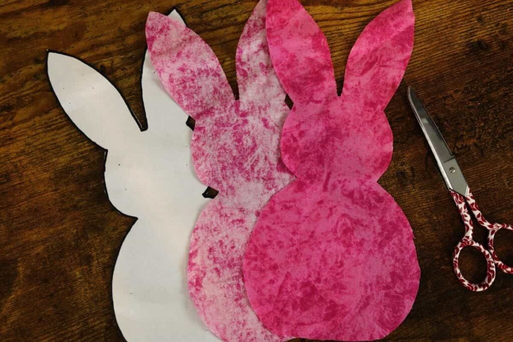 stuffed bunny sewing pattern and fabric cut out with scissors