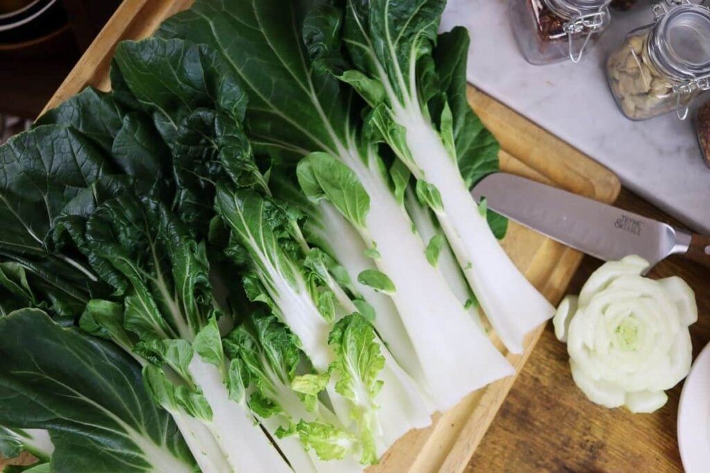 fresh bok choy on a cutting board