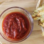 overview of a condiment dish of homemade ketchup.