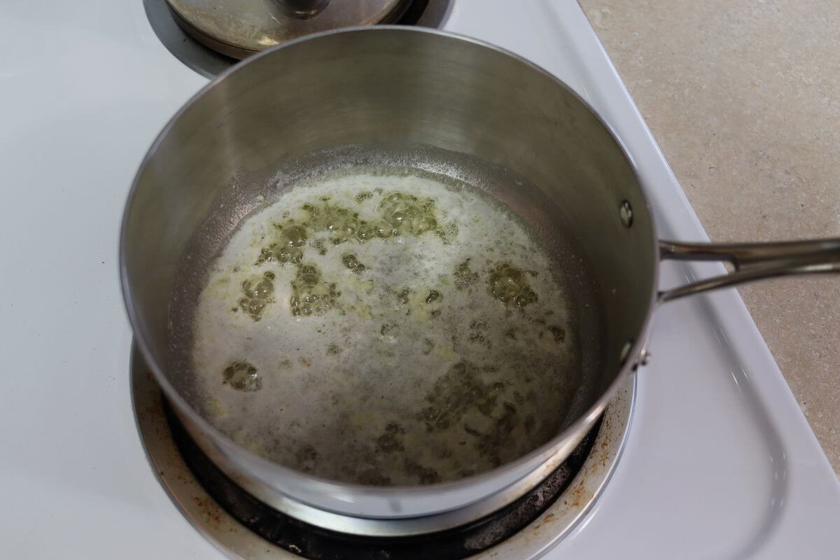 Butter and garlic simmering in a saucepan.