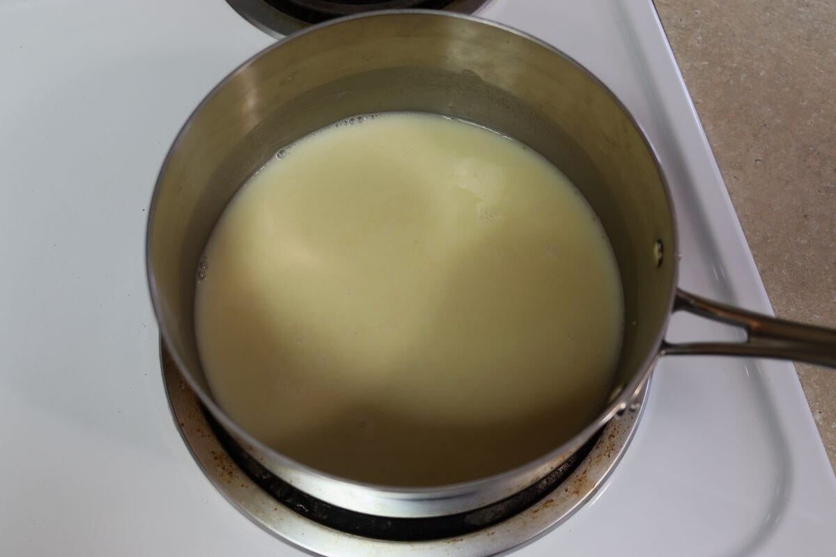 A white cream sauce in a saucepan.