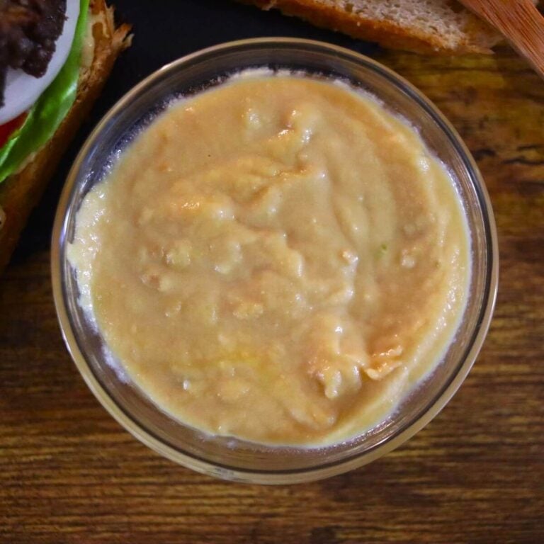 Glass dish of dijon mustard.