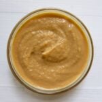 Homemade Dijon mustard with a thick, creamy texture in a glass bowl.