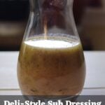 Glass carafe of creamy submarine dressing with “Deli-Style Sub Dressing That Creamy Italian Bite” text overlay.