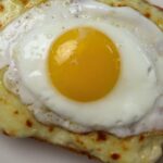 Croque madame sandwich with sunny side up egg and “Classic French Café Sandwich” text overlay.