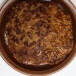 Homemade hot Italian sausage patties in a brown bowl with “Homemade Hot Italian Sausage Recipe” text overlay.