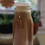 Bottle of peanut butter cup coffee creamer with “Peanut Butter Cup Coffee Creamer Recipe” text overlay.