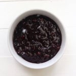 Blueberry compote in a white bowl.
