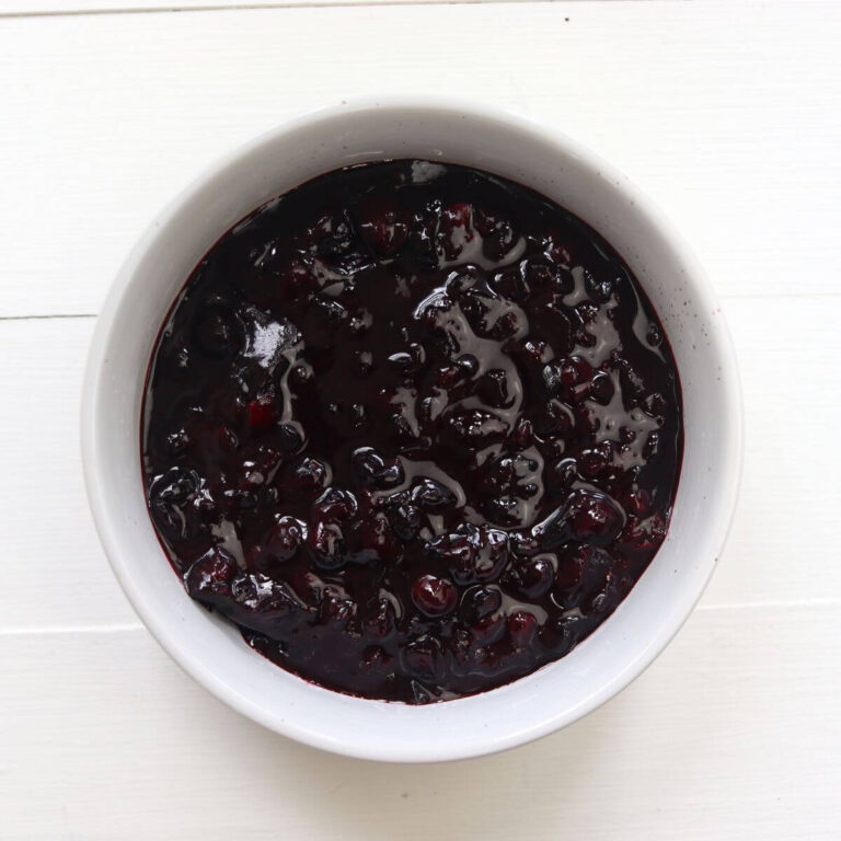 Blueberry compote in a white bowl.