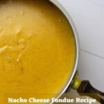 Nacho cheese fondue in a fondue pot with wooden handle. Overlay text reads "Nacho Cheese Fondue Recipe".