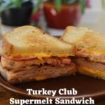 Cut turkey sandwich with bacon, cheese, and dressing. Text overlay reads "Turkey Club Supermelt Sandwich".