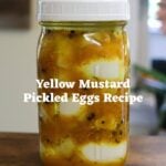 Jar of yellow mustard pickled eggs with text overlay "Yellow Mustard Pickled Eggs Recipe".