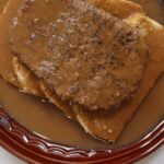 Hot hamburger sandwich with brown gravy over white bread. Overlay text reads "Hot Hamburger Style (classic diner-style recipe)".