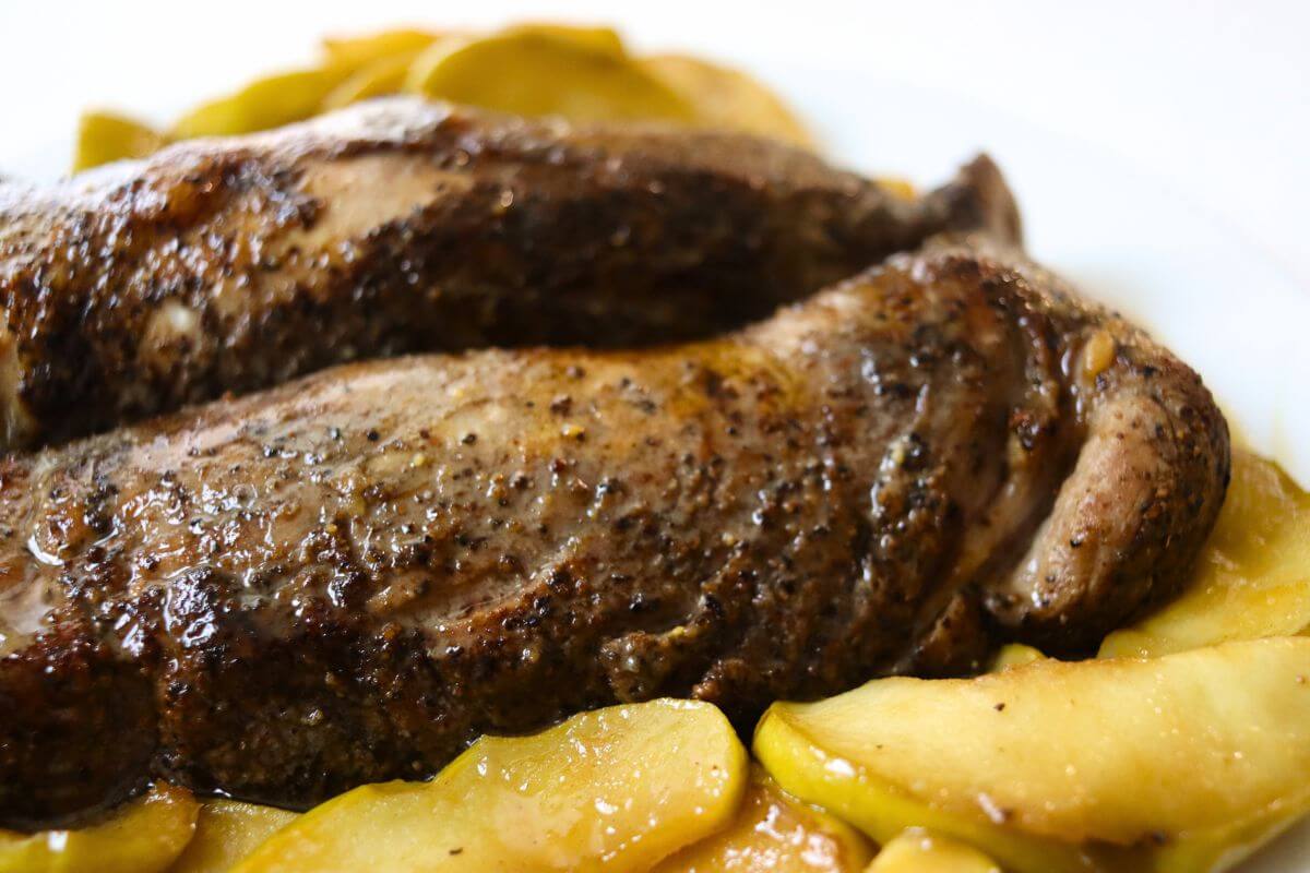Roasted apple and pork tenderloin served with tender cooked apples and maple Dijon sauce.