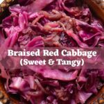 Braised red cabbage with cooked apples and onions in a wooden bowl with text overlay “Braised Red Cabbage (Sweet & Tangy)".