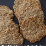 Thin browned sausage patties on black slate with text reading “Breakfast Sausage Patty Recipe".