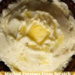 Mashed potatoes from scratch topped with melting butter in a wooden bowl. Text reads “Mashed Potatoes From Scratch".