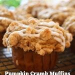 Pumpkin crumb muffins with cinnamon streusel topping and vanilla icing on a cooling rack. Text overlay: Pumpkin Crumb Muffins.