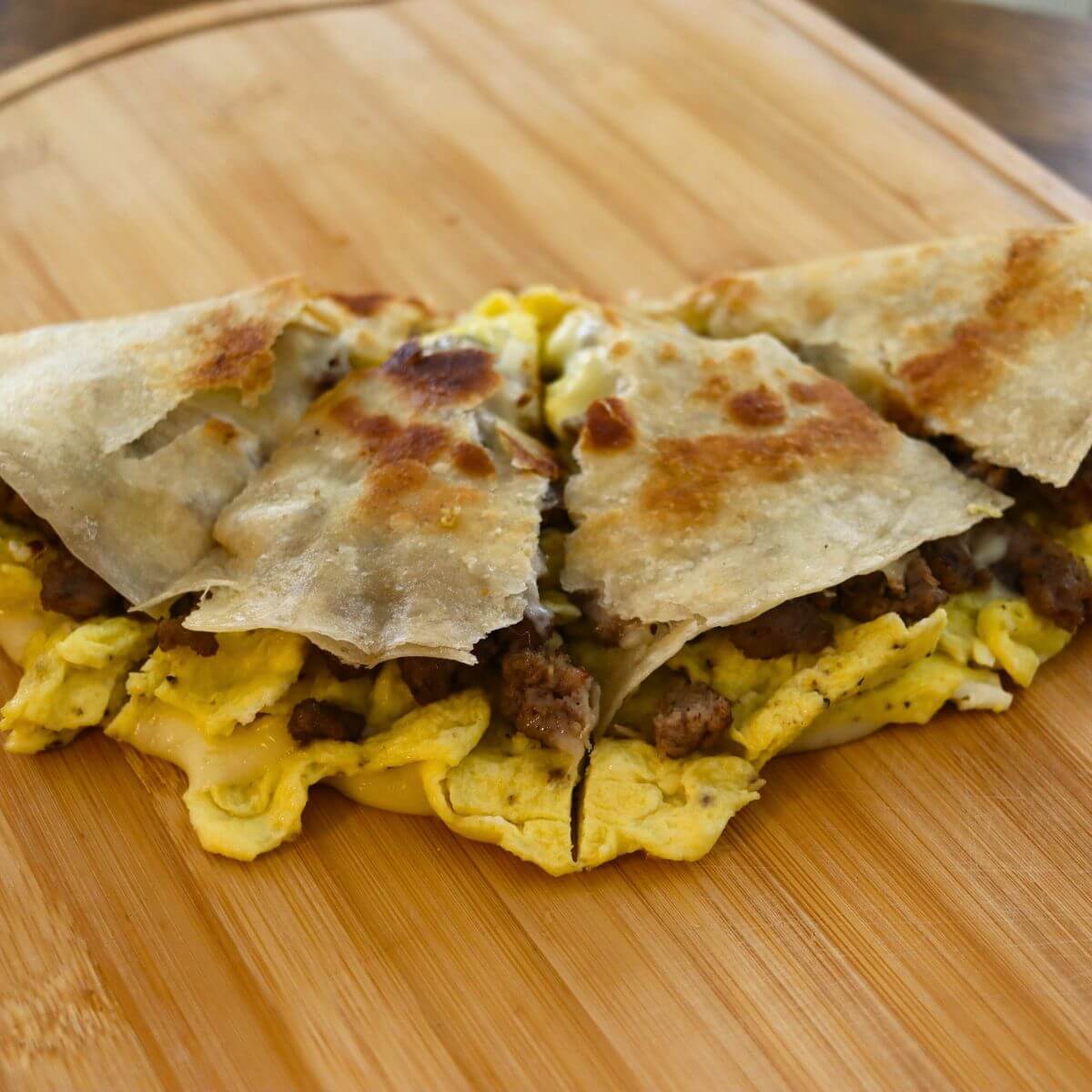 Sausage and egg quesadilla filled with scrambled eggs, breakfast sausage, and melted cheese.