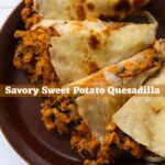Sweet potato quesadilla on a brown plate. Text overlay reads "Savory Sweet Potato Quesadilla".