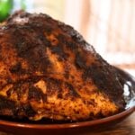 Cajun turkey breast with browned seasoned skin and Cajun Turkey Breast text overlay.